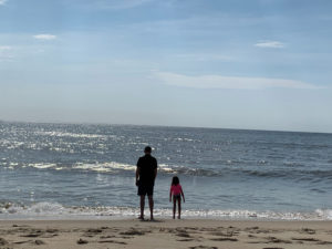 Chris and daughter at the ocean